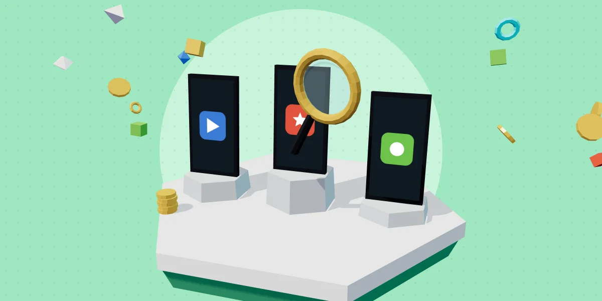 Three game concepts on pedestals with a magnifying glass on the leading one